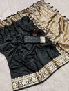 Black saree with gold embroidery on a light gray background